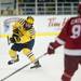 Michigan junior defenseman Kevin Clare gets rid of the puck on Saturday. Michigan lost to Miami 4-3. Daniel Brenner I AnnArbor.com